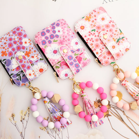 Tarjetero de piel con estampado floral para mujer