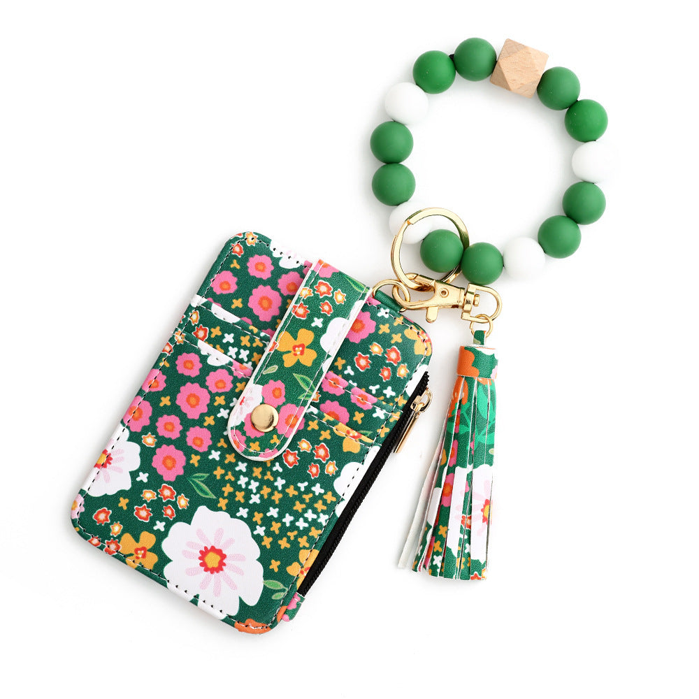 Tarjetero de piel con estampado floral para mujer