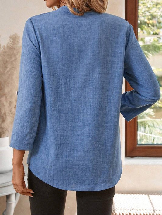 Blusa camisera manga larga de cuello entallado primavera