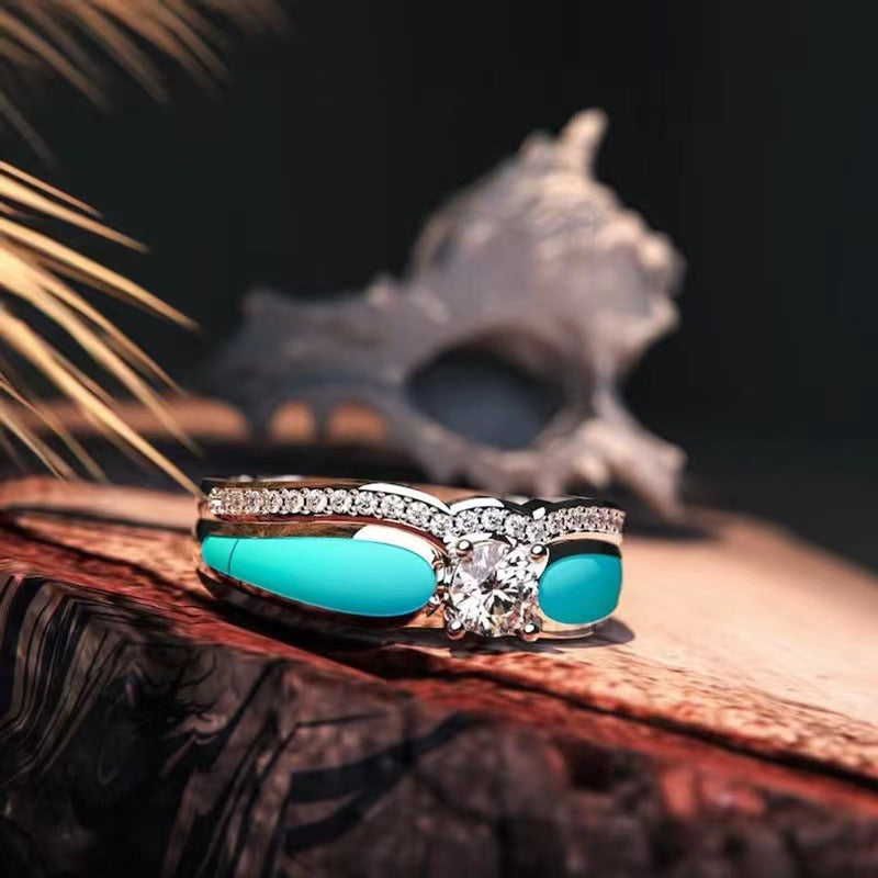 Anillo de mujer con dos piezas azules y diseño de ondas de diamantes