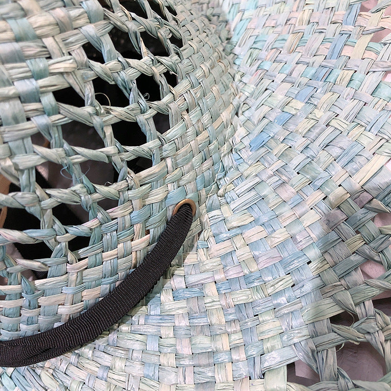 Sombrero de rafia con ala grande y borlas