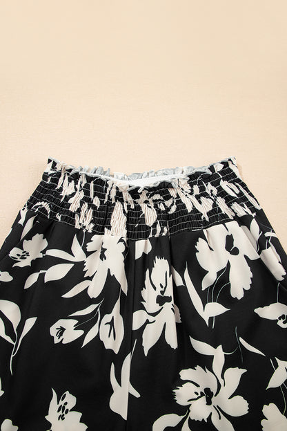 Pantalones anchos de cintura alta con fruncido y estampado floral negro