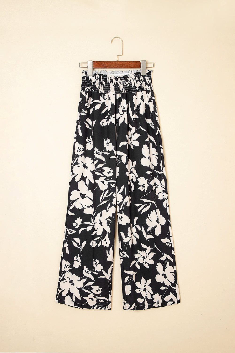 Pantalones anchos de cintura alta con fruncido y estampado floral negro