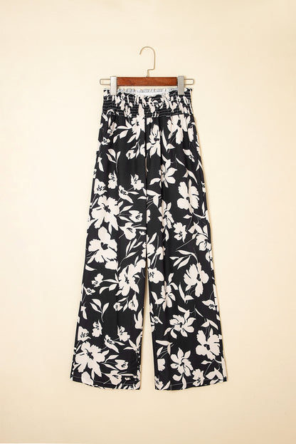 Pantalones anchos de cintura alta con fruncido y estampado floral negro