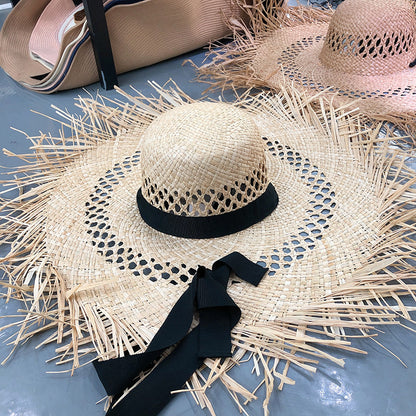 Sombrero de rafia con ala grande y borlas