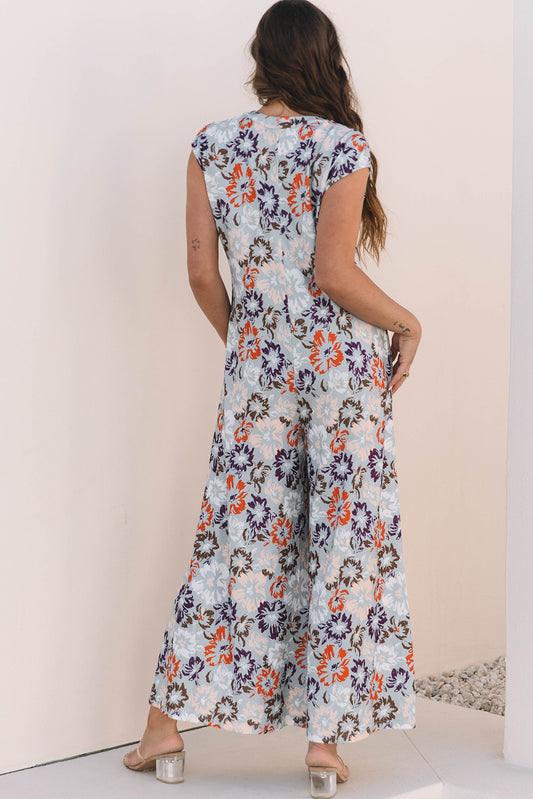 Mono de pierna ancha con bolsillos botones sin mangas con estampado floral azul cielo