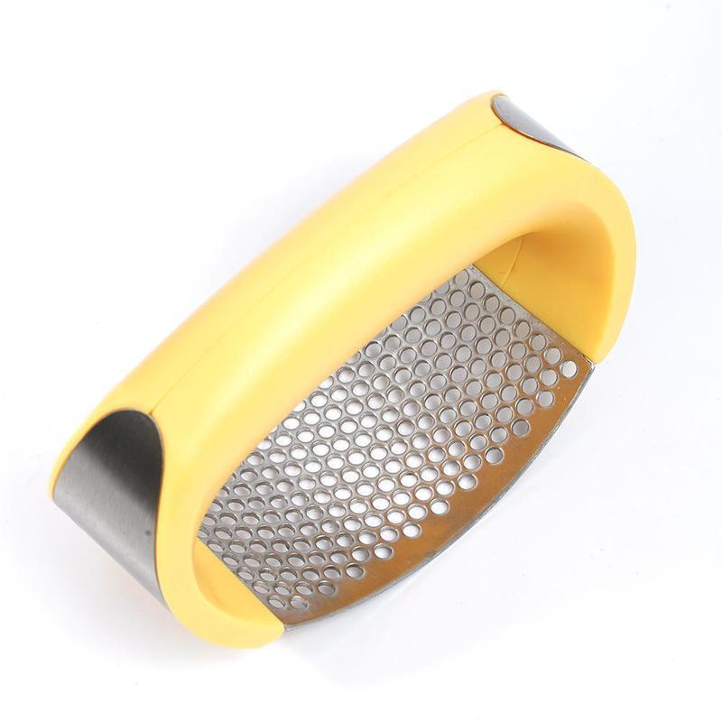 Curved stainless steel garlic crusher