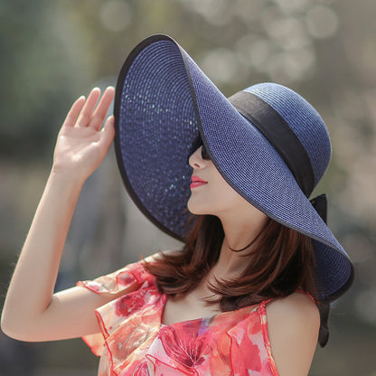 Sombrero versátil de ala grande con lazo decorativo