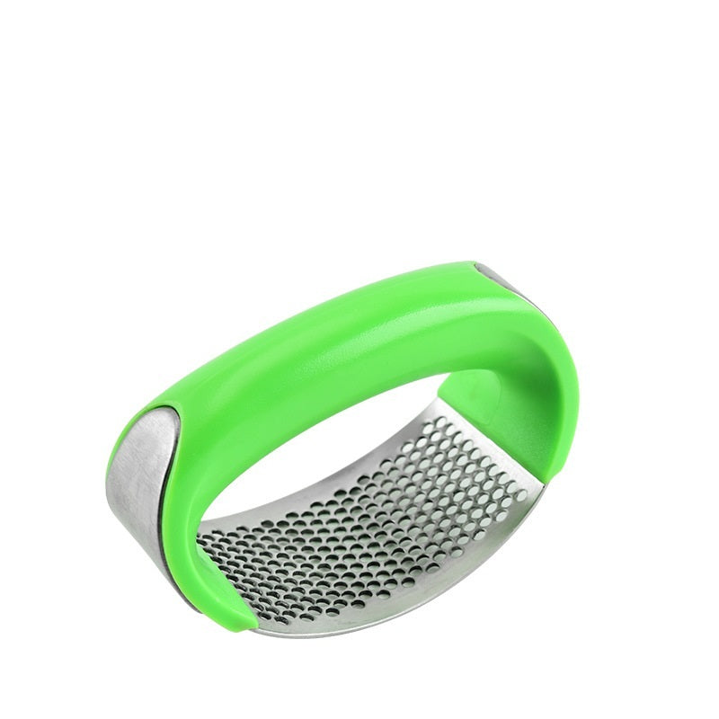 Curved stainless steel garlic crusher