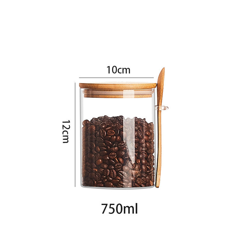Set of glass containers with wooden spoon