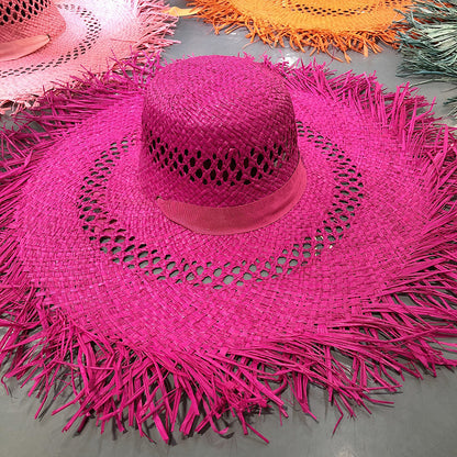 Sombrero de rafia con ala grande y borlas