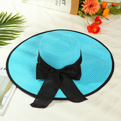 Sombrero versátil de ala grande con lazo decorativo