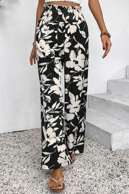Pantalones anchos de cintura alta con fruncido y estampado floral negro