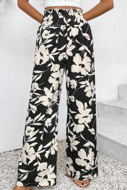 Pantalones anchos de cintura alta con fruncido y estampado floral negro