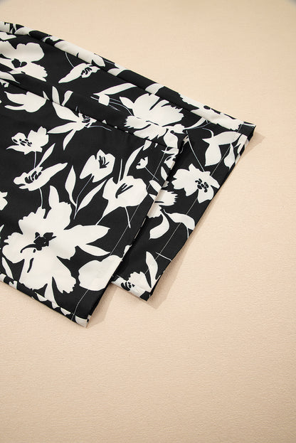 Pantalones anchos de cintura alta con fruncido y estampado floral negro