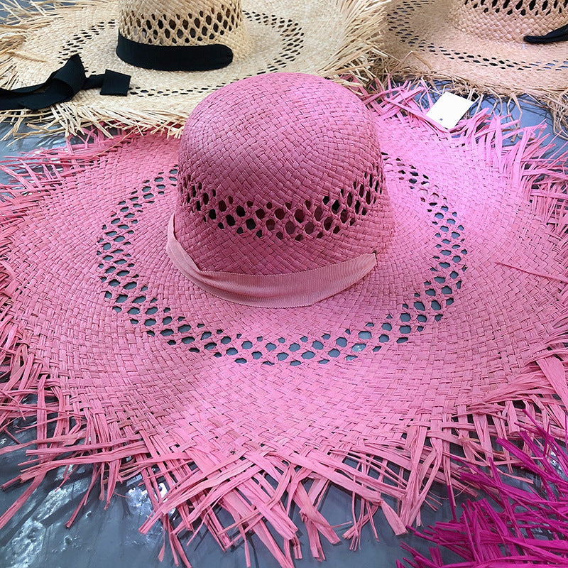 Sombrero de rafia con ala grande y borlas