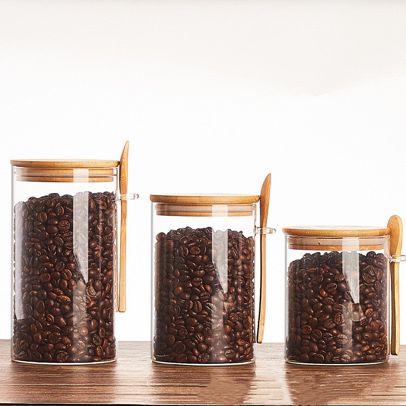 Set of glass containers with wooden spoon