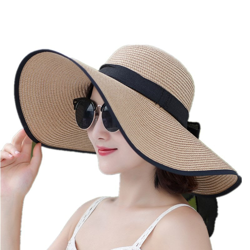 Sombrero versátil de ala grande con lazo decorativo