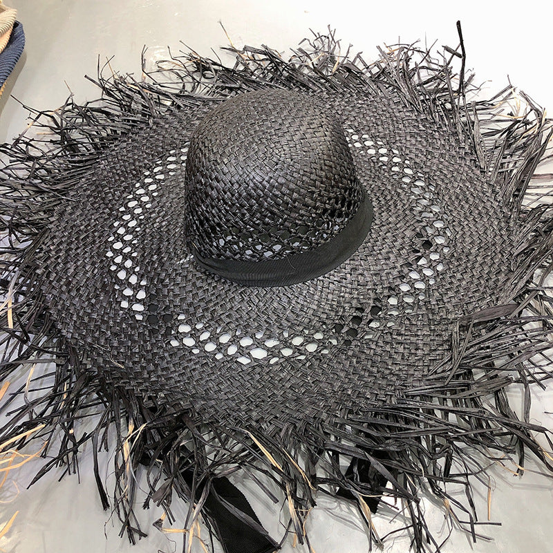 Sombrero de rafia con ala grande y borlas