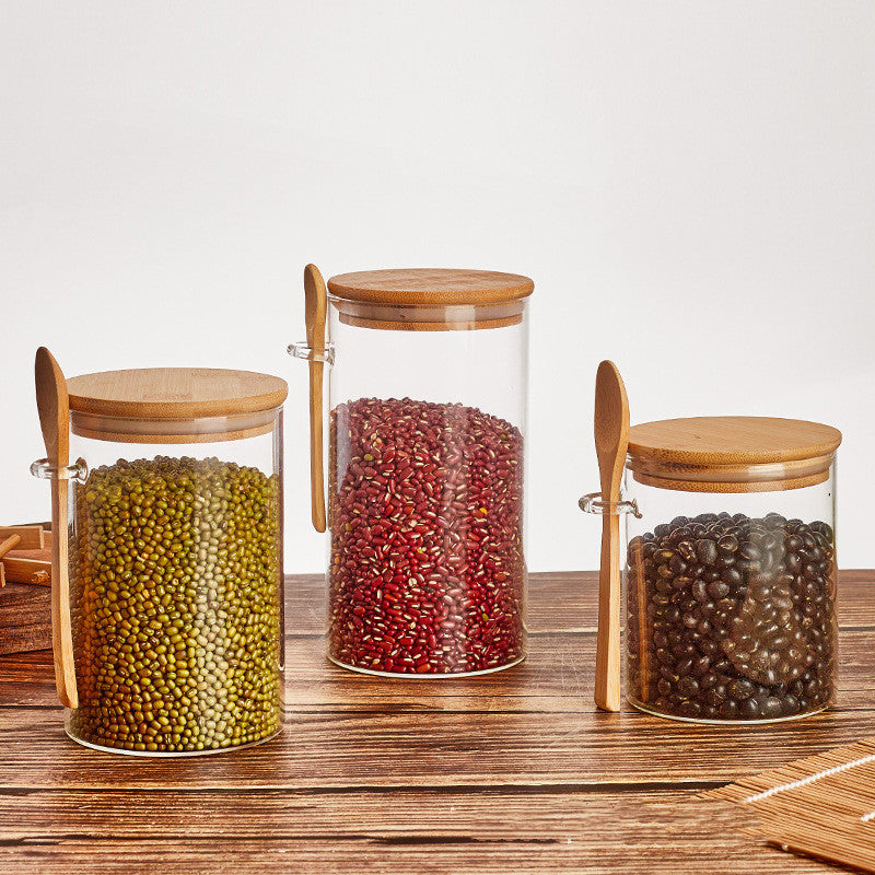 Set of glass containers with wooden spoon