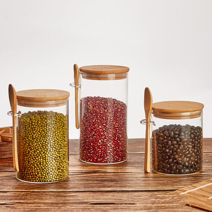 Set of glass containers with wooden spoon