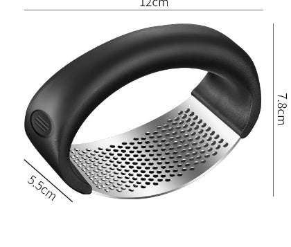 Curved stainless steel garlic crusher