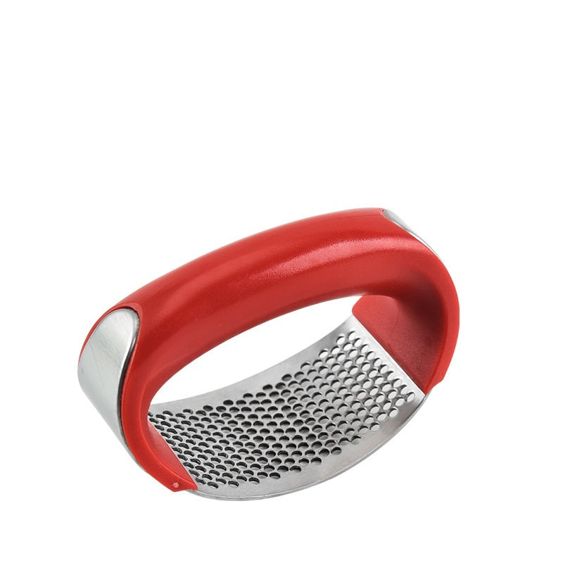 Curved stainless steel garlic crusher