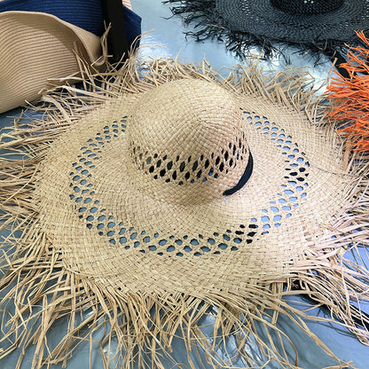 Sombrero de rafia con ala grande y borlas