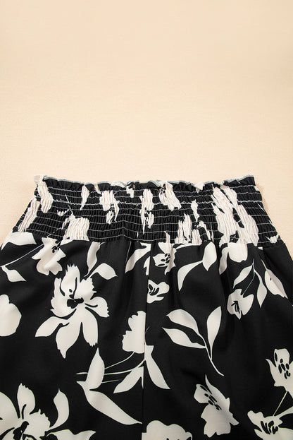 Pantalones anchos de cintura alta con fruncido y estampado floral negro