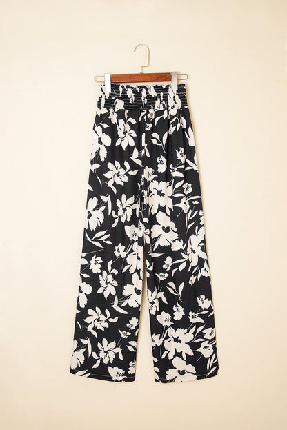 Pantalones anchos de cintura alta con fruncido y estampado floral negro