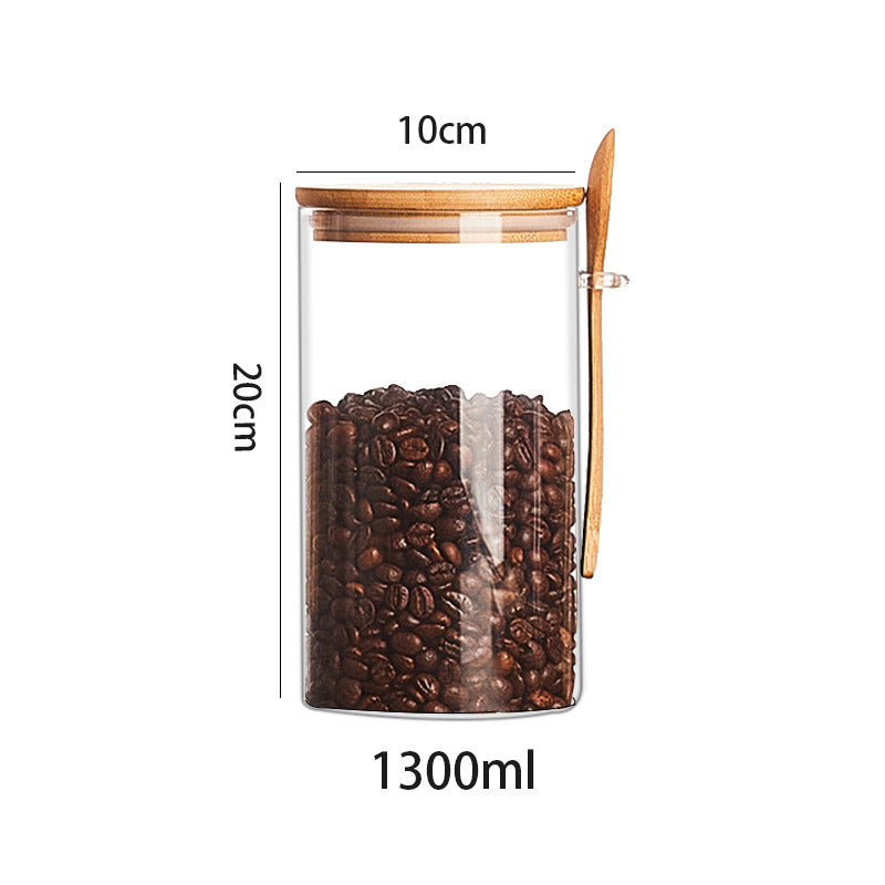 Set of glass containers with wooden spoon