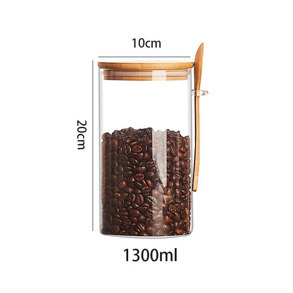 Set of glass containers with wooden spoon